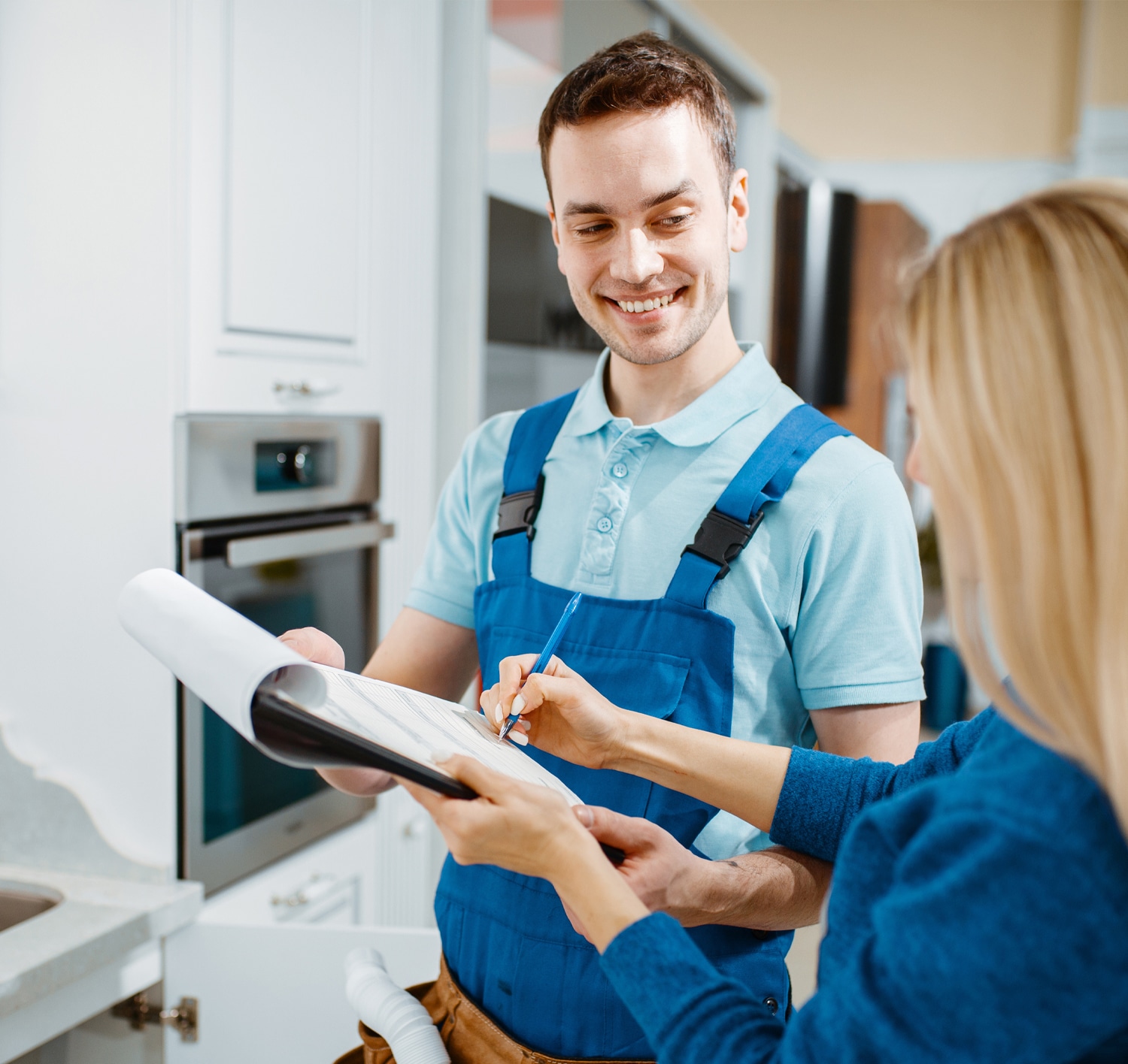 A plumber speaking with his customer