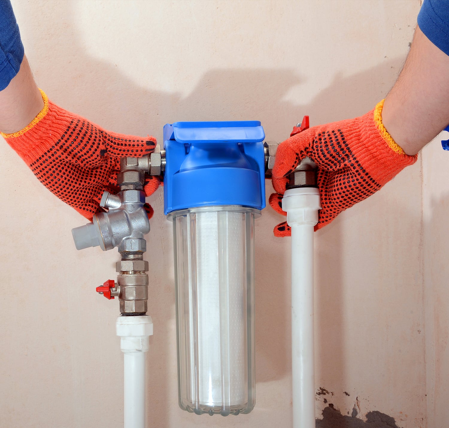 Plumbing installing a home water filter