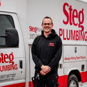 a man standing in front of a truck